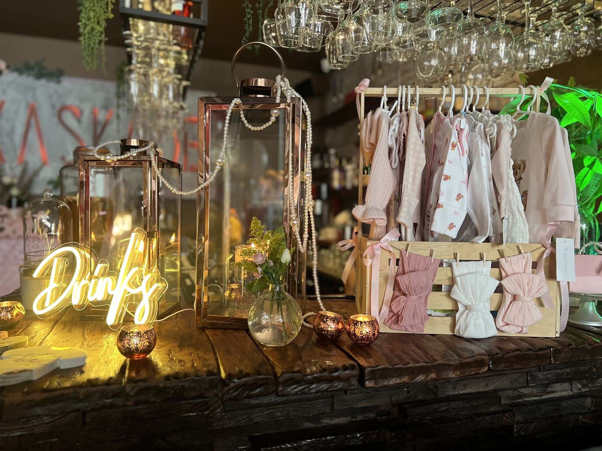 The bar at Kaskade lit for a private party, with lanterns and the Kaskade sign behind